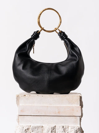 #colour_gold,Grande Ripple Carabiner shown with Dumpling Handbag (Pebbled Leather) in Black/Gold
