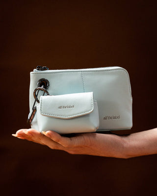 #colour_sky-gunmetal,Mini Utility Case shown with Petite Pouch (Nappa Leather) in Sky/Gunmetal, Mini Connector Clip and Grande Carabiner in Gunmetal